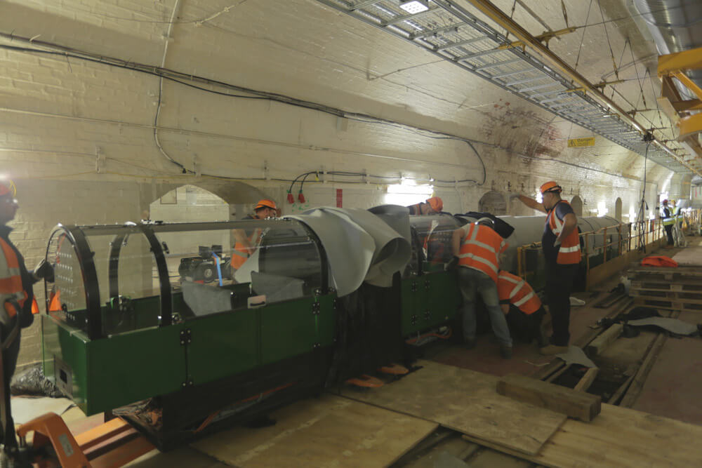 Carriage being installed on tracks underground at the Postal Museum